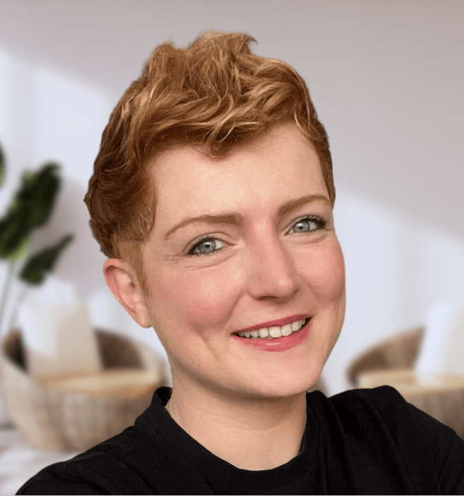 Headshot of Hannah Dixon with short reddish hair