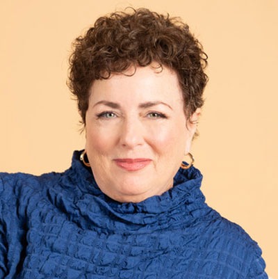 Jill-Lublin-headshot-square Headshot of Jill Lublin wearing a blue turtleneck