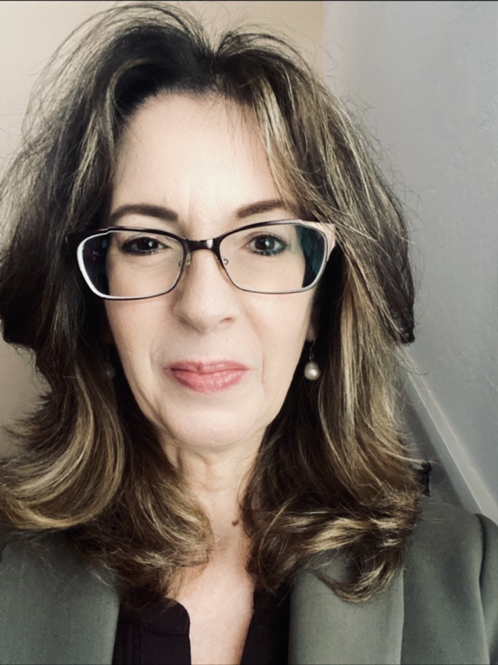 Headshot of Lisa Towles wearing glasses