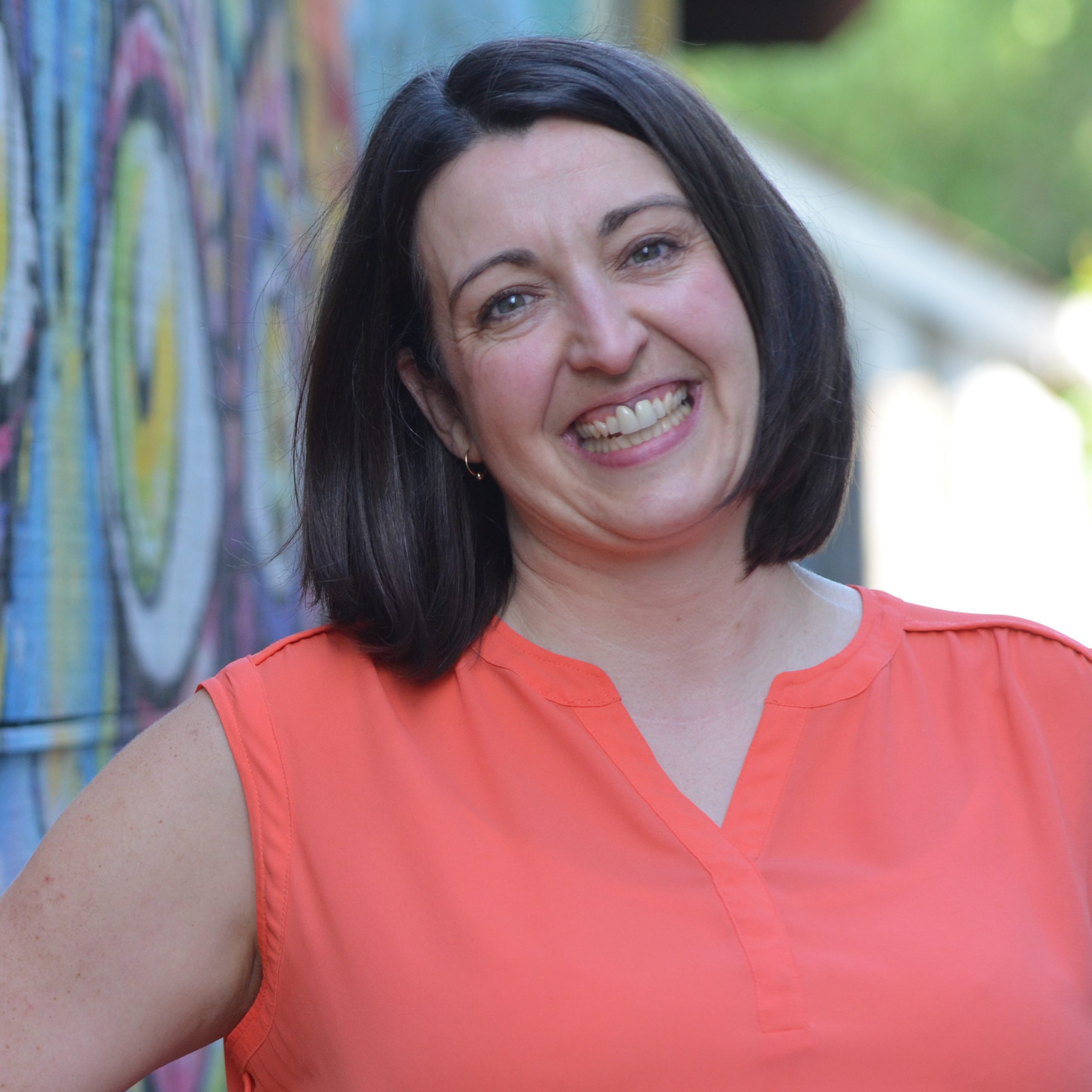 Headshot of Lisa Wilson - wearing coral top smiling