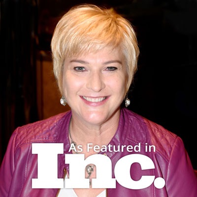 Headshot of Michelle Calloway, CEO of REVEALiO and Founder of Tech With Heart Network-Purple Jacket