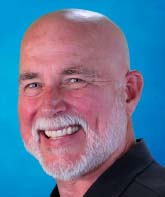 Headshot of Rick Broniec - male with gray beard smiling
