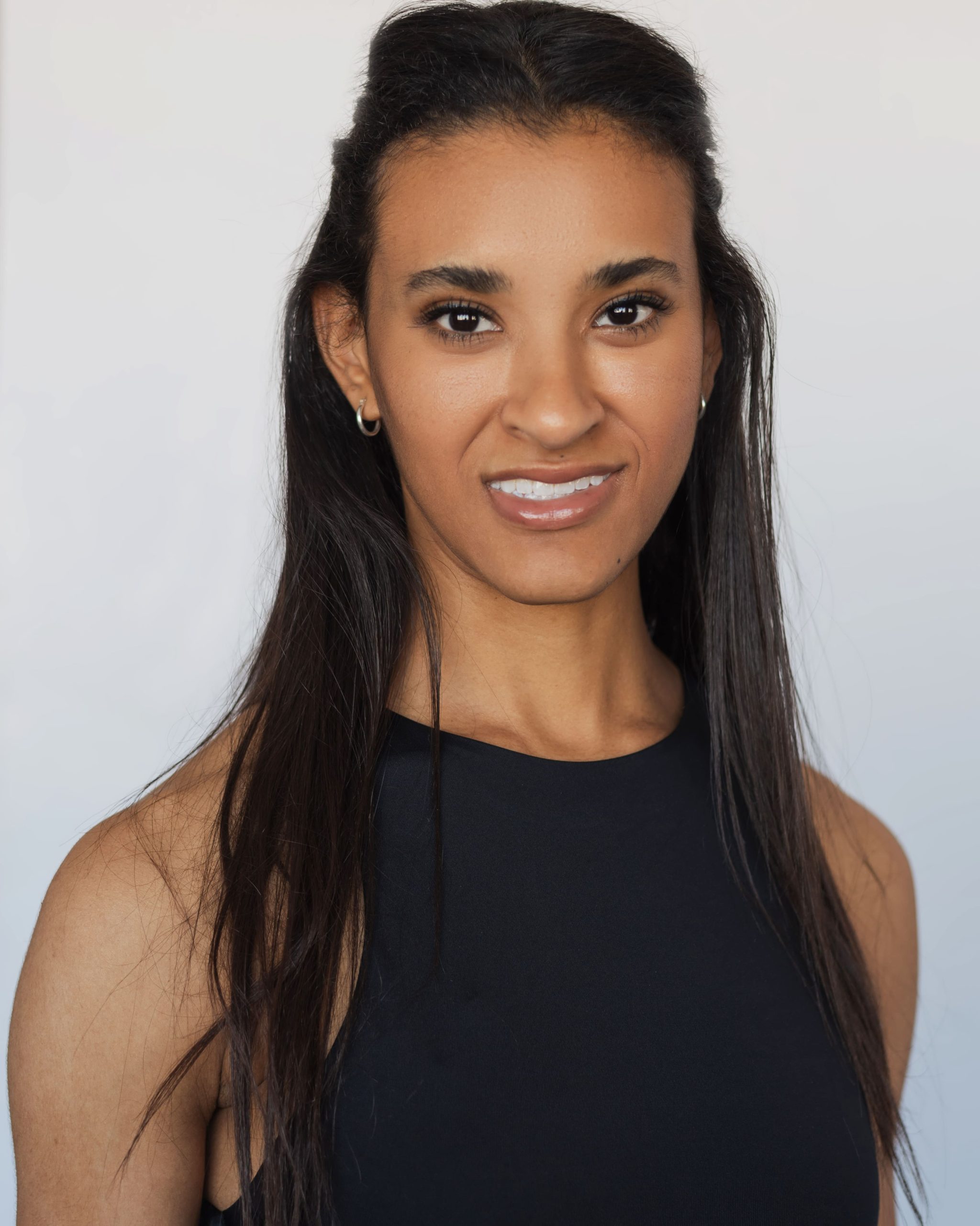 Headshot of Sydnee Stevenson wearing black top